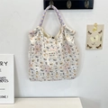 Detail of quilted canvas tote with cute puppy prints and colorful braided rope handles - Latte Blue Dog