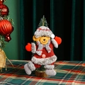 Detailed view of a plush Christmas bear ornament with a red snowflake button detail - New Dancing Bear