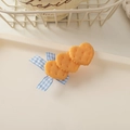 Detail showing heart-shaped biscuit hair clips with blue checkered ribbon on a tray - Bowknot Biscuit-Heart