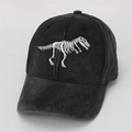 Close-up of a black washed cotton baseball cap featuring a white T-Rex skeleton embroidery - 48-53cm (2-8 Years) / Black