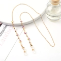 Golden eyewear chain featuring colorful evil eye charms and clear silicone loops - 1176-5 (Red/Yellow/Purple Eye)