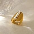 Detail of a wide gold ring featuring five gradient white pearls on a textured surface - Wide Face Five Artificial Pearls Style (G11117202)