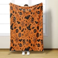 Detail of Halloween flannel blanket featuring pumpkin ghosts and BOO text in orange and black - Style 3-Orange Black Skeleton Pumpkin