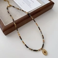 Tiger eye beaded necklace with a golden sunburst oval pendant in a vintage wooden box - Tiger Eye Necklace XL0362