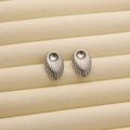 Polished silver 18K titanium steel stud earrings with radiant ribbed texture and petal shape - R192 Oval Stripes / Steel