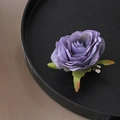 Elegant purple fabric rose hair clip with green leaves on black wooden tray - Angel Rose / Purple