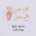 Macro detail of 13x14mm gold hollow bow nail art charms with embossed metal design - Gold Bowknot-9654