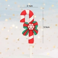 Detail of Christmas candy cane cake topper with green bow showing 5.5cm height dimension - New Soft Glue Candy Cane