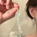 Detail view of light green floral tassel earrings with translucent beaded petals - 14# Silver Earring Post - Silver - Blue