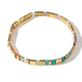 Multicolor Tila bead stretch bracelet featuring gold-tone metal and vibrant enamel segments - Candy Color Splicing