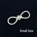 Small silver bow brooch featuring intricate white crystal pavé setting in a detailed view - Bowknot (Small)
