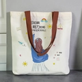 Large white canvas tote bag with brown handles featuring inspirational sun and rainbow prints - Learning Like a Sail