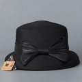 Close-up of black straw sun hat featuring a large bow and fine woven texture detail - M (56-58cm) / Black