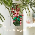 Green Christmas bell with red plaid bow and holly leaves hanging on a pine tree branch - Round with Bells / Green