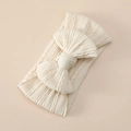 Detail of baby cable knit headband with large bow in off-white soft stretchy nylon fabric - Off White