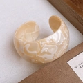Detail of wide marbled resin cuff bracelet featuring a polished beige and white finish - 40# Bangle-Cream White-Acetate Plate