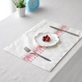 Linen placemat with red fish pattern and scalloped edges for dining table decor - Fish