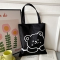 Black oxford canvas tote bag with white cartoon bear pattern and top zipper closure - Black with Sleeping Bear