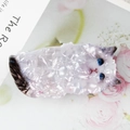 Chic pearlescent ragdoll cat hair claw clip with blue eyes on floral magazine background - Ragdoll Cat