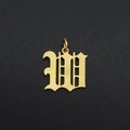 Macro shot of gold-plated stainless steel Gothic letter W pendant for DIY jewelry - Letter W