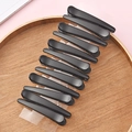 Set of 10 matte black duckbill hair clips displayed on a wooden tray with a pink background - 9# 7.5cm Small Matte Black