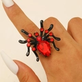 Detail shot of a gothic black spider ring featuring vibrant red crystal rhinestones - Red Zirconia Style (3937) / Electrophoretic Black