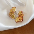 Detailed close-up of golden ginkgo leaf earrings with red enamel edges on white silk - Retro Ginkgo Leaf Petal Style (Gold-Red)