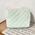 Detailed view of quilted cotton cosmetic bags in pink and green with zipper closure - Green Plaid Clutch Bag