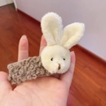 Close-up of soft plush rabbit hair clip in cream and brown curly faux fur texture - Hair Clip-Brown Bunny