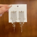 Close-up of silver tassel star earrings with sparkling rhinestones on branded card - Star Tassel Style (10#) / Silver