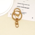 Gold DIY jewelry tool kit with lobster clasp and keychain ring set on a beige tray - Figure 8 Swivel Clasp / Gold