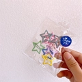 Close-up of star-shaped candy-colored metal hair clips for girls in transparent packaging - Star Shape (10Pcs)
