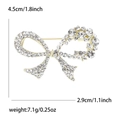 Broche nœud dorée en alliage avec strass transparents et mesures de taille - Imitation Or