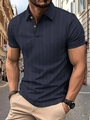 Detail of navy knit polo shirt featuring herringbone texture and gold buttons - Dark Blue