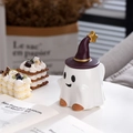 Detail of white ceramic ghost mug featuring a dark purple wizard hat lid with gold stars - 16oz / Smiling Ghost (With Witch Hat Lid)