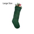 Detailed view of large dark green knitted Christmas stocking with cable knit texture - L Green