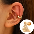 Elegant gold ear cuff featuring a twisted design with sparkling white zircon stones - KC Gold - Spiral Diamond Style (4088)
