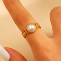 Close-up of golden curb link chain ring with a central white pearl on a model finger - Chain Pearl Ring (11772)