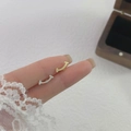 Minimalist 925 silver smile curved stud earrings in gold and silver finish shown on hand - Smile / Silver