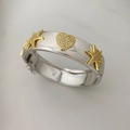 Adjustable silver bangle with gold heart and star charms featuring cubic zirconia - Star + Heart Hollow Bangle / Silver