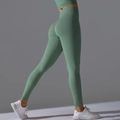 Detailed back view of high waisted seamless scrunch leggings in sage green - Fog Moss Green