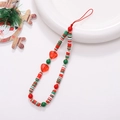 Close-up of handmade beaded phone strap with red heart and Christmas theme beads - K1438 Polymer Clay Heart Phone Chain