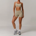 Seamless ribbed yoga set in beige featuring racerback sports bra and high-waist shorts - S / Bra + Shorts / Terracotta