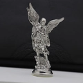 Detailed close-up of Saint Michael vintage metal statue fighting a dragon on base - Steel