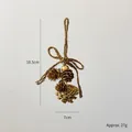 Christmas pine cone ornament with three gold painted cones and natural hemp rope bow decor - Small Gold Pinecone