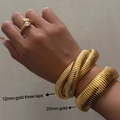 Three gold snake-style bracelets and rings in 18k plated titanium steel on female wrist - 3-Layer/Width 12mm/Length 18cm / Gold