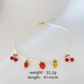 Pearl necklace with colorful fruit charms featuring cherry, strawberry, and pineapple. - Fruit Pendant Necklace / Colorful