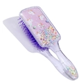 Detail of pink unicorn hairbrush with purple wavy bristles and colorful floating foam beads - Colorful Pony