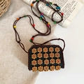 Close-up of handmade crochet crossbody bag with wooden flowers and colorful beads - Square Style with 16 Small Flowers