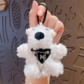 White plush bear keychain with black carabiner and metallic M charm detail - Dog with Glasses - Black (No Tag)